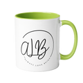 White mug with green interior and handle, featuring a logo and text on a white background