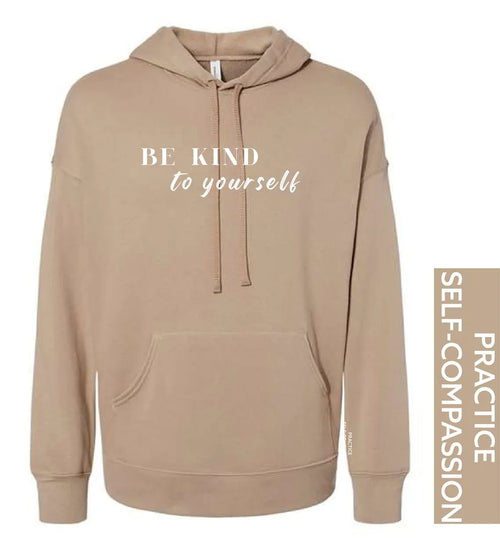 Beige hoodie with 'BE KIND to yourself' text on a white background